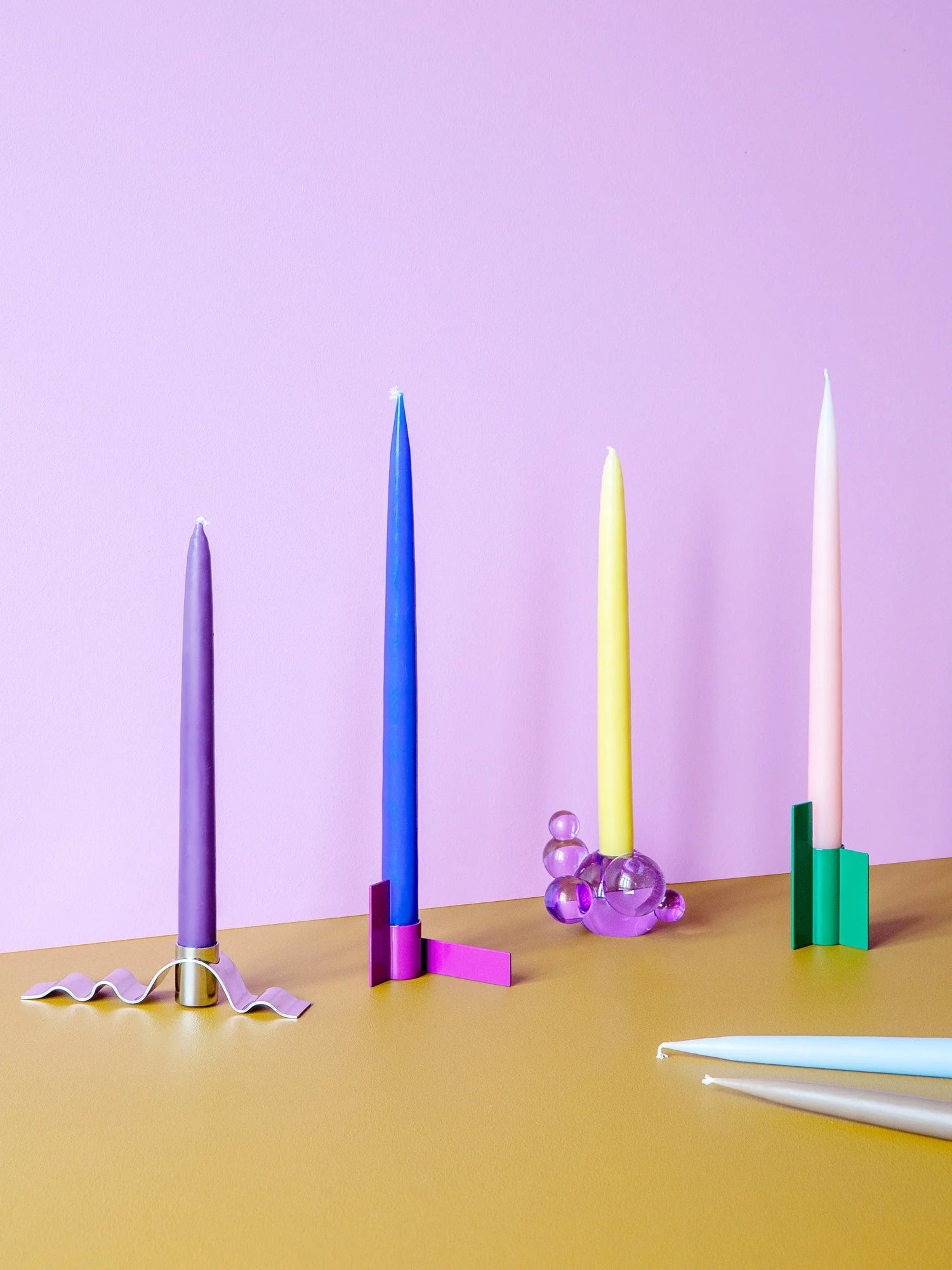 Danish-made green candlestick with a sleek stainless steel finish, ideal for adding sophistication to any room.