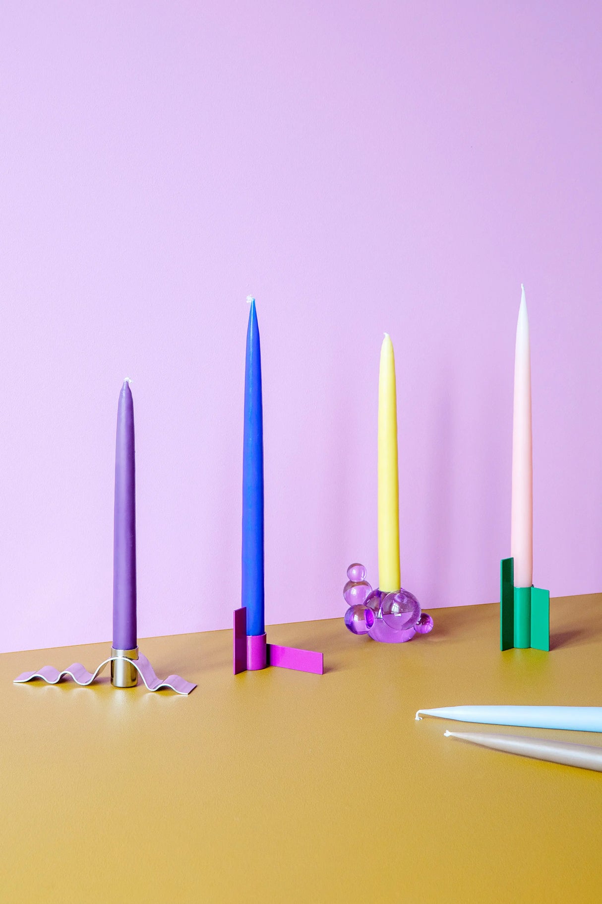 Danish-made green candlestick with a sleek stainless steel finish, ideal for adding sophistication to any room.