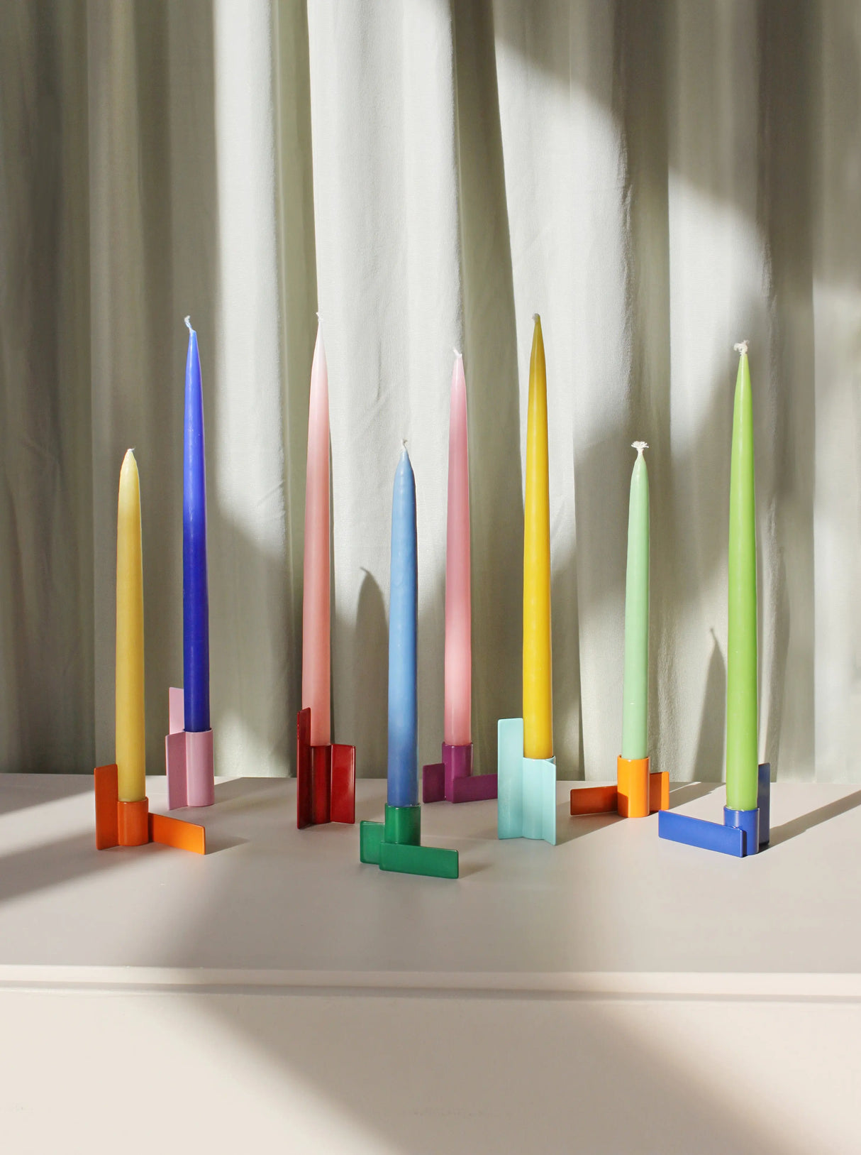 Striking orange Icon Candlestick 01, a modern graphic statement piece that enhances your home décor with its clean lines and geometric design