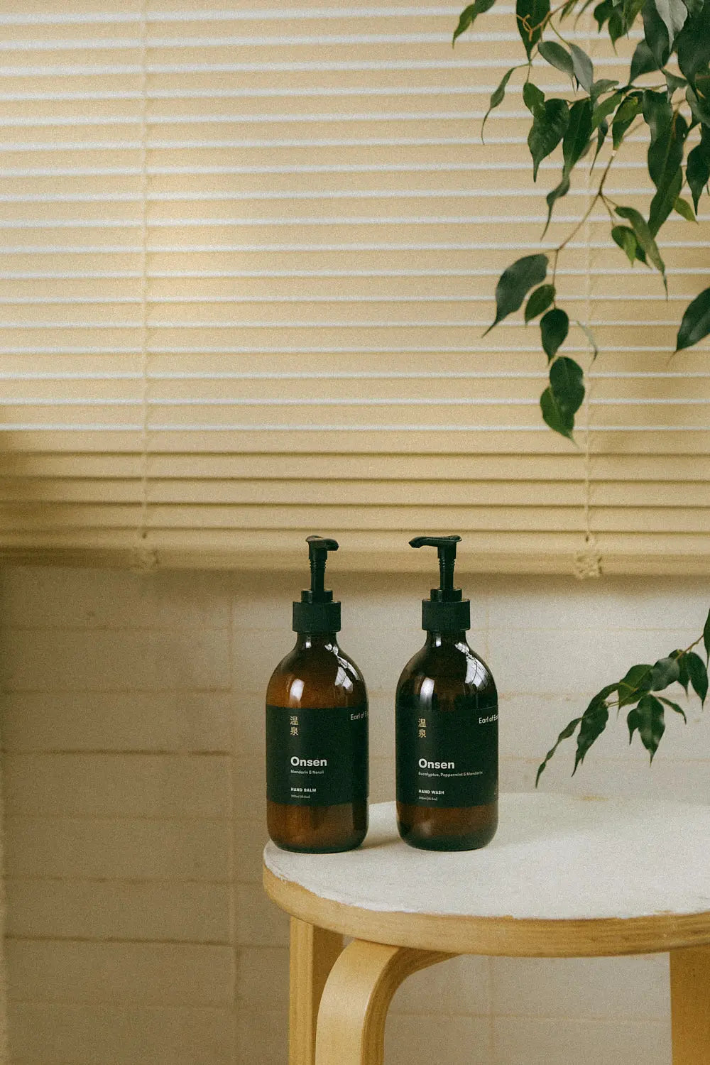 Earl of East Onsen Hand Balm placed in a stylish bathroom setting, perfect for daily skincare rituals.