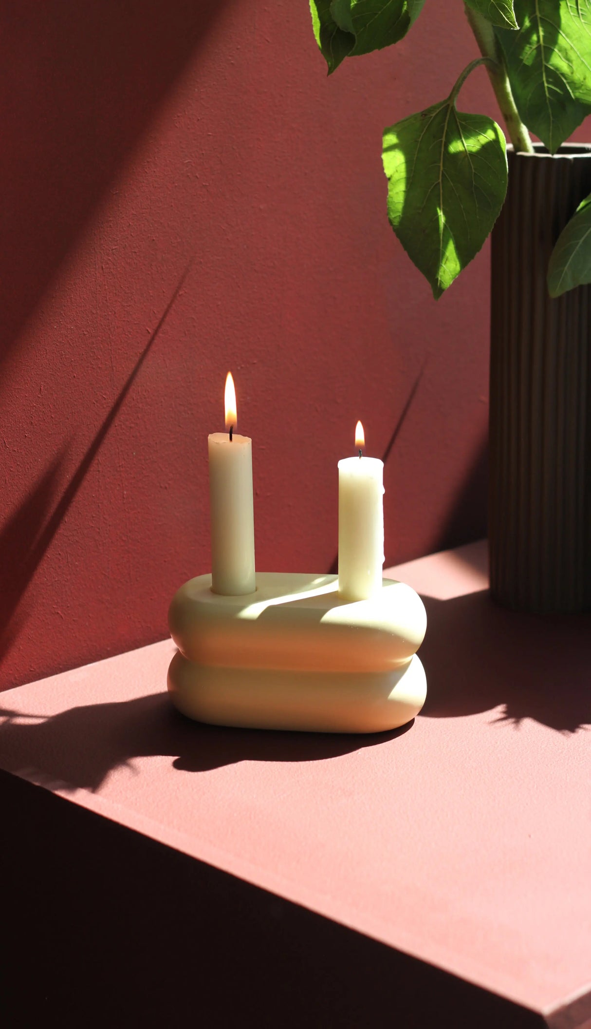 Chic ceramic candlestick in soft pastel yellow, designed to hold two candles for a stylish display