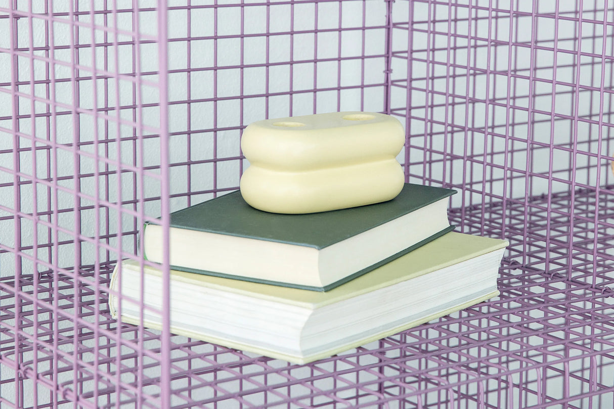 Handcrafted ceramic candlestick with a unique matte yellow glaze, ideal for brightening your space