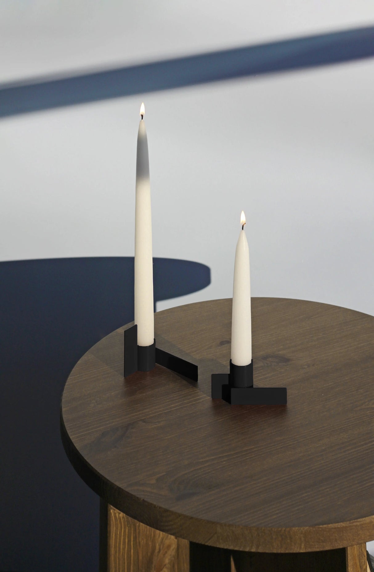 Elegant and unique matte black geometric candlestick by Stences, featuring interlocking rectangles for versatile styling