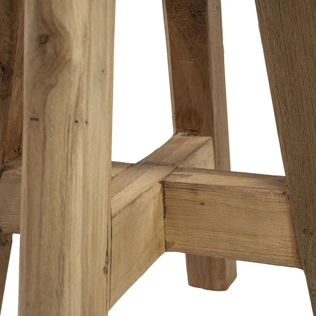 Side view of the Atziri Teak Wood Stool, highlighting its sturdy legs and smooth, round top