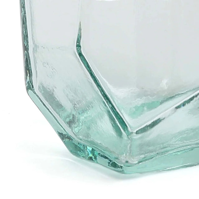 Close-up of the Origami Glass, highlighting its intricate folds, smooth texture, and eco-friendly recycled glass material.
