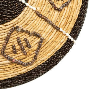 Cozumel Handwoven Wall Art, featuring black accents on natural banana leaf, adding bold and sophisticated style to any room