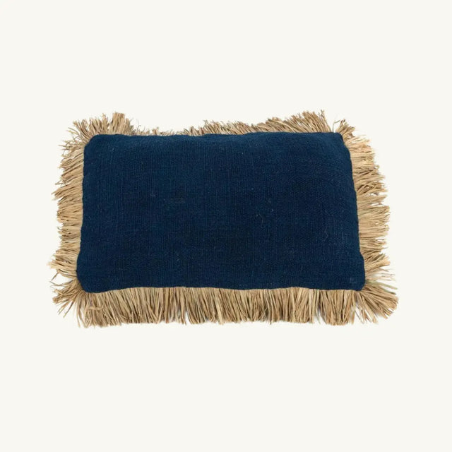 Elegant blue cotton cushion cover with raffia fringes, perfect for adding a boho chic touch to your interior or terrace