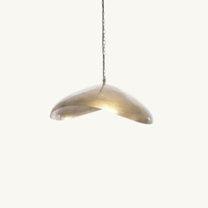 The Fortune Cookie brass pendant light with an organic iron frame, offering a blend of modern aesthetics and timeless sophistication