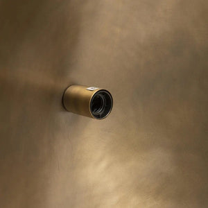 The Fortune Cookie brass pendant light with an organic shape creates a striking focal point, perfect for modern or classic interiors.