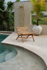 Perfect for covered outdoor spaces, the Islander Essence Chair, made from durable teak wood, offers elegance and comfort for patios, gardens, and more.