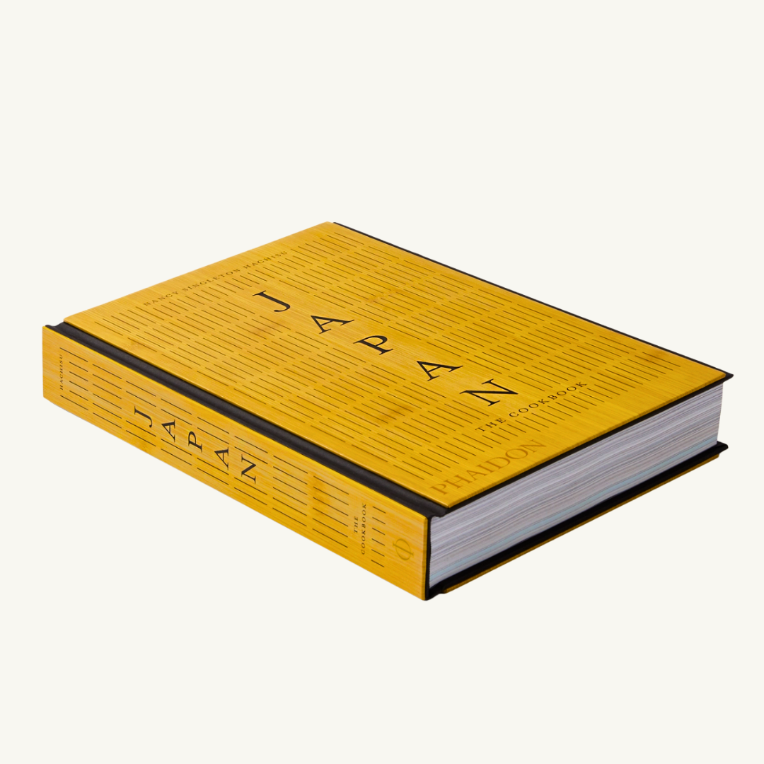 Japan: The Cookbook placed on a kitchen counter with fresh ingredients