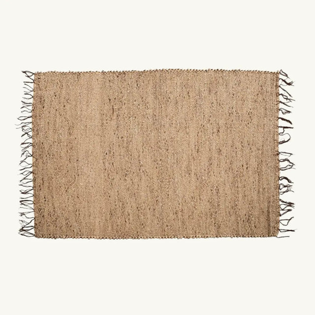 The Killing Field Seagrass Carpet features a generous XL design with fringe edges, crafted from natural seagrass to bring a serene, eco-friendly ambiance to any room