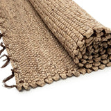 The Killing Field Seagrass Carpet is handmade by skilled artisans in Vietnam, offering a unique, artisanal touch to your home decor