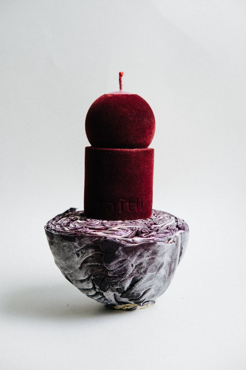 Elegant wine velvet soy candle wrapped in luxurious cotton velvet, crafted by Taith for a sophisticated touch to modern interiors.