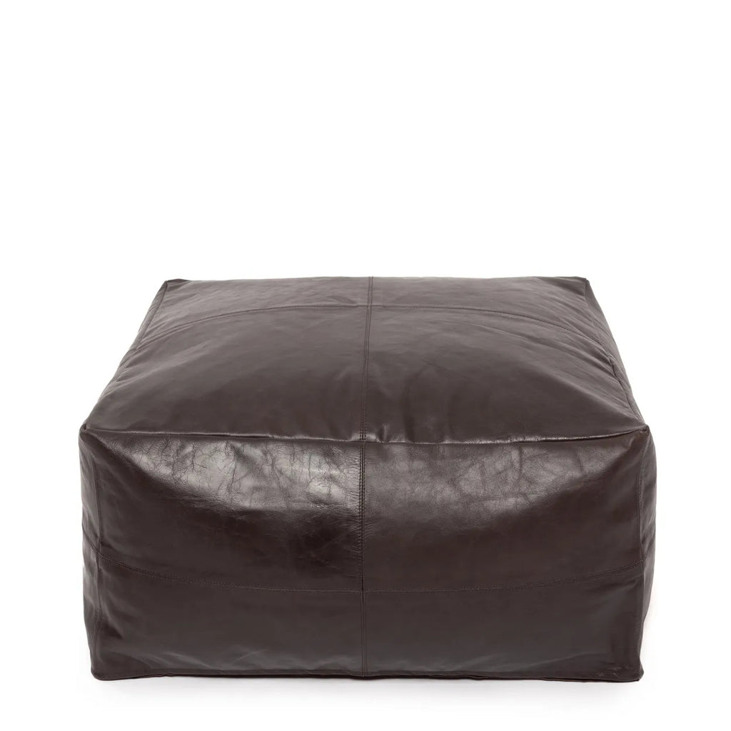 Soft chocolate nappa leather pouffe, a chic and functional addition to your living or bedroom, offering comfort and style.