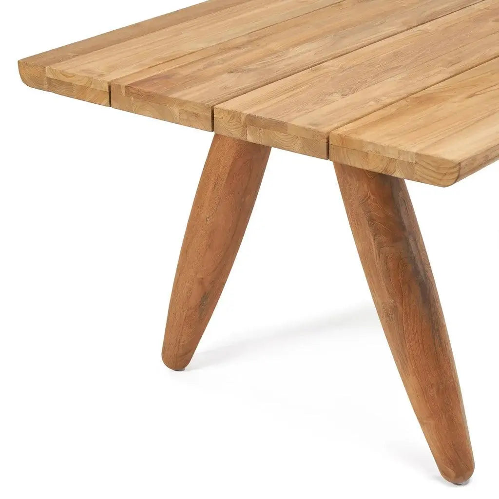 The Matita Dining Table set in an indoor dining room, creating a bold and contemporary focal point. Perfect for dinner parties or casual meals, made with sustainable materials for eco-conscious living.