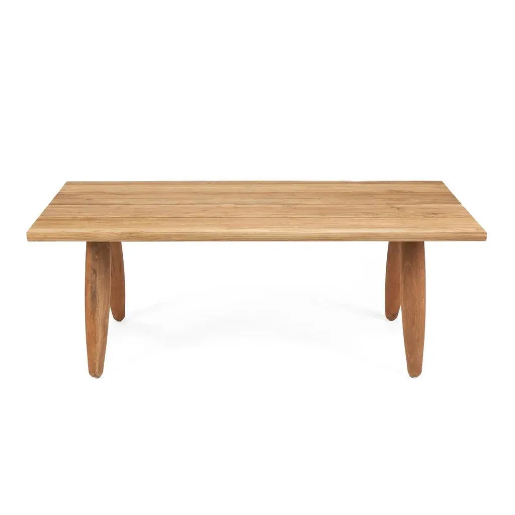 The Matita Dining Table in an outdoor patio setting, showing its versatility for both indoor and outdoor use. Built to withstand the elements, this table combines modern design with durability.