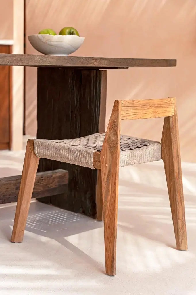 Crafted from recycled teak wood, the Marathi Chair offers a sustainable option for stylish and comfortable seating