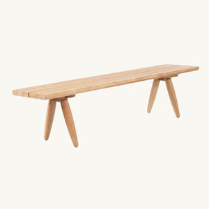 Side view of the Matita Bench, showcasing its unique design with upcycled teak wood, original table legs, and smooth curves. Ideal for adding a modern touch to your bedroom or living space.