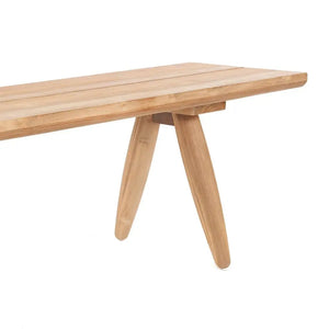 The Matita Bench placed at the end of a bed, offering both style and functionality. Made from upcycled teak wood, this versatile bench enhances any bedroom with a modern, sustainable look.