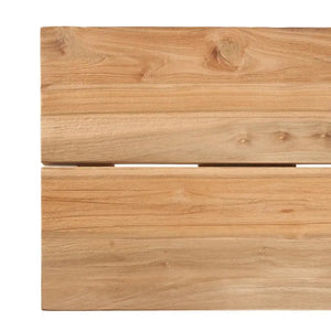 Detail of the Matita Bench’s unique curves and original table legs, showcasing artisan craftsmanship. A durable and eco-friendly piece made from upcycled teak wood.