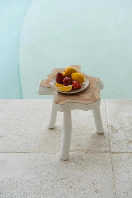 Close-up of the Organic Side Table in Natural White, highlighting its distinctive organic shape and smooth teak wood finish. A stylish, versatile addition to any home decor.