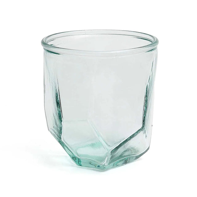The Origami Glass in blue, beautifully styled on a table, adding a modern and artistic touch to a drinkware collection.