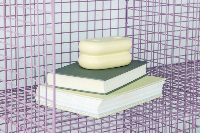 Handcrafted ceramic candlestick with a unique matte yellow glaze, ideal for brightening your space