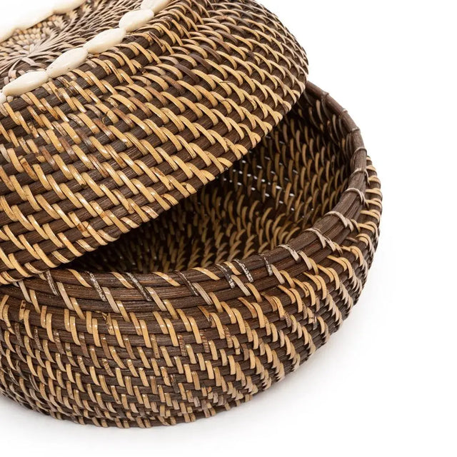 A set of Colonial Peek-a-Boo Rattan Baskets, beautifully handcrafted from dark rattan and adorned with cowrie shells, perfect for stylish and functional storage.