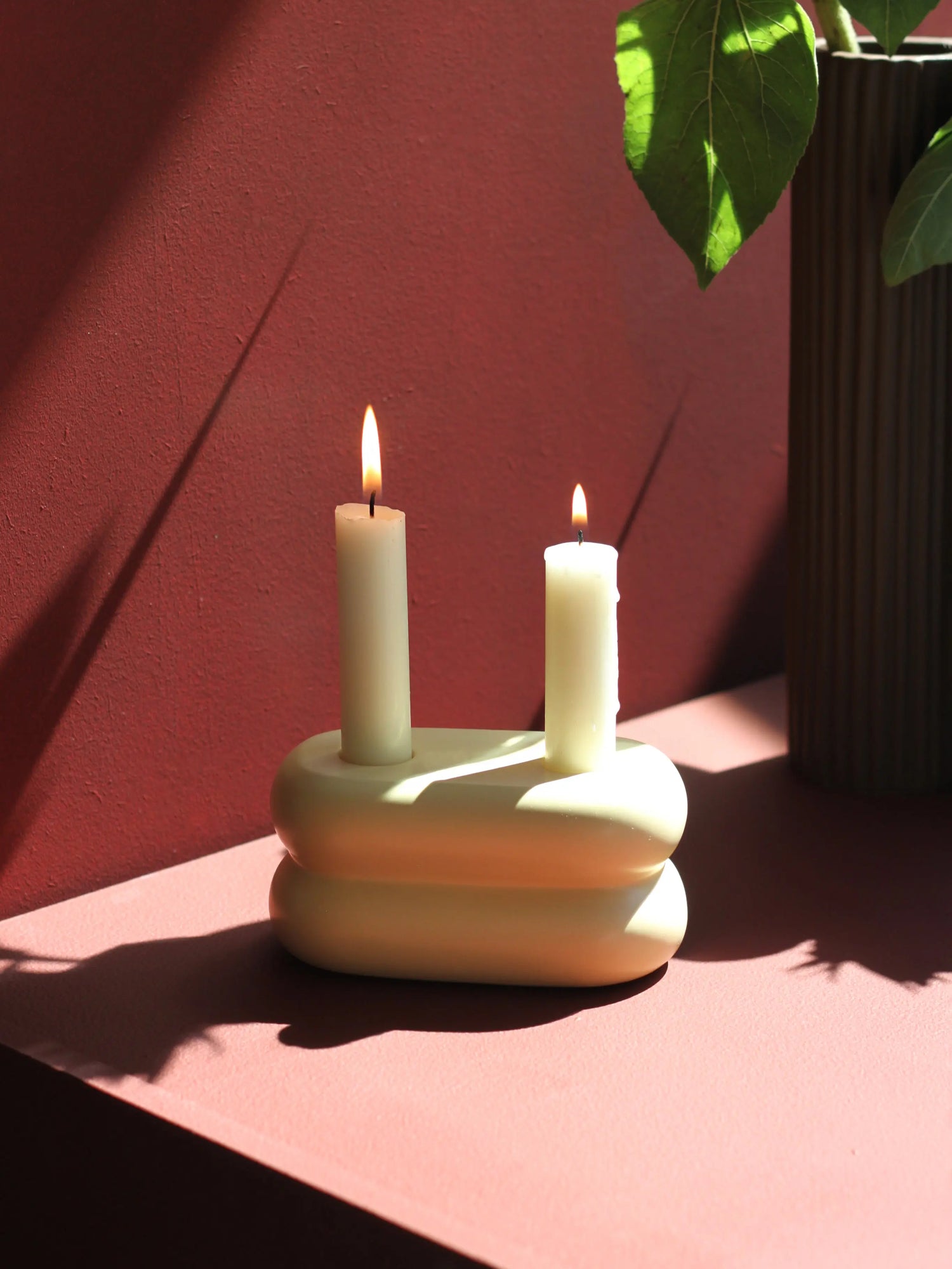 Chic ceramic candlestick in soft pastel yellow, designed to hold two candles for a stylish display