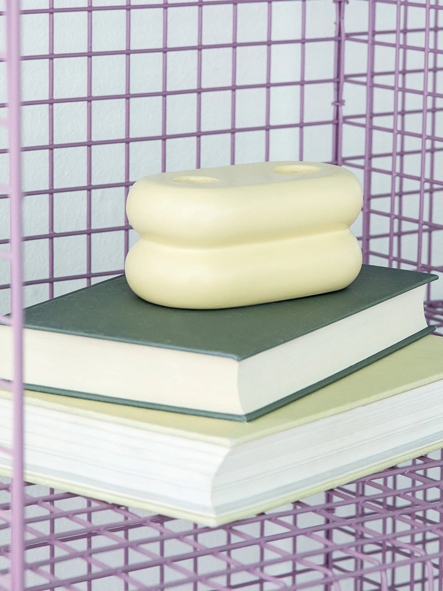 Handcrafted ceramic candlestick with a unique matte yellow glaze, ideal for brightening your space