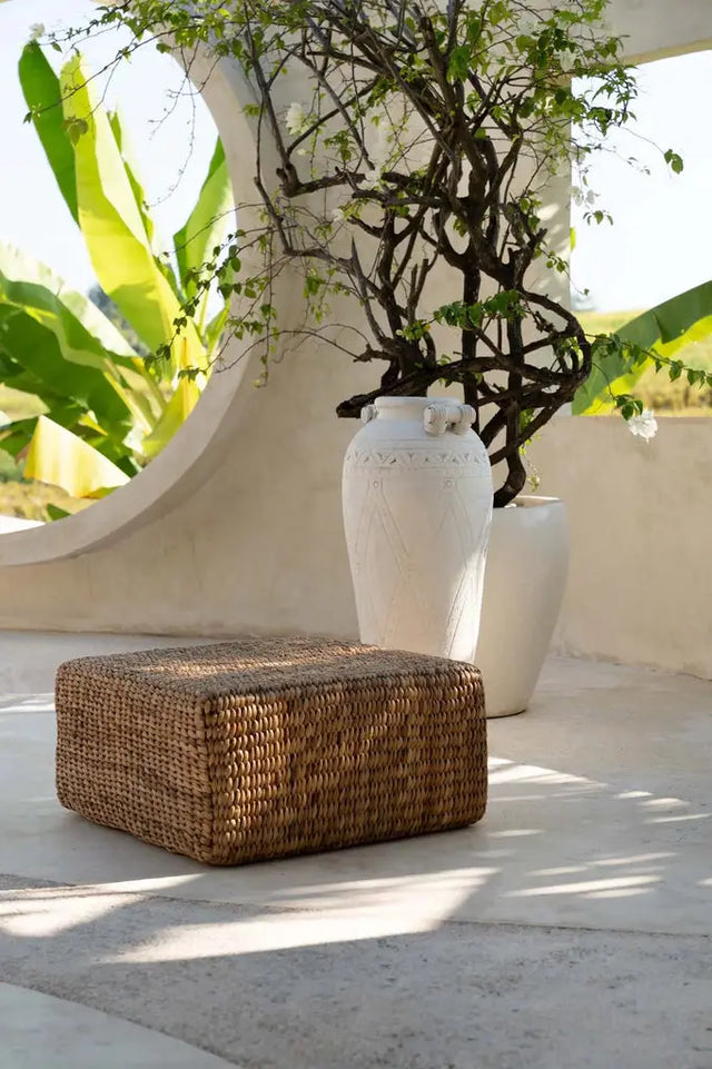 Eco-friendly square pouffe made from sustainable hyacinth fibers, adding unique texture and a boho-chic touch to your room