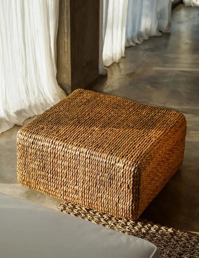 Handwoven hyacinth square pouffe, ideal for adding eco-conscious flair and comfort to your home, with a bohemian aesthetic