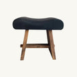 Minimalist stool crafted from suar wood and black leather, ideal for adding modern elegance to any living space