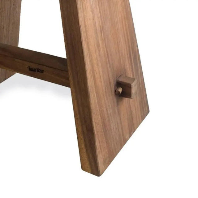 Elegant suar wood stool with black leather seat, perfect for adding a touch of sophistication and practicality to your home