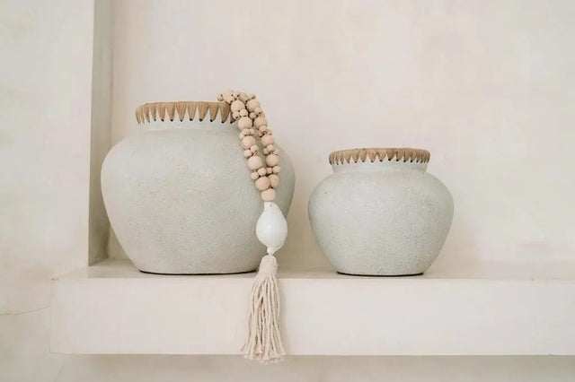 The 'Styly' Vase combines terracotta and rattan to create an elegant and rustic piece for your living room, bathroom, or covered outdoor space