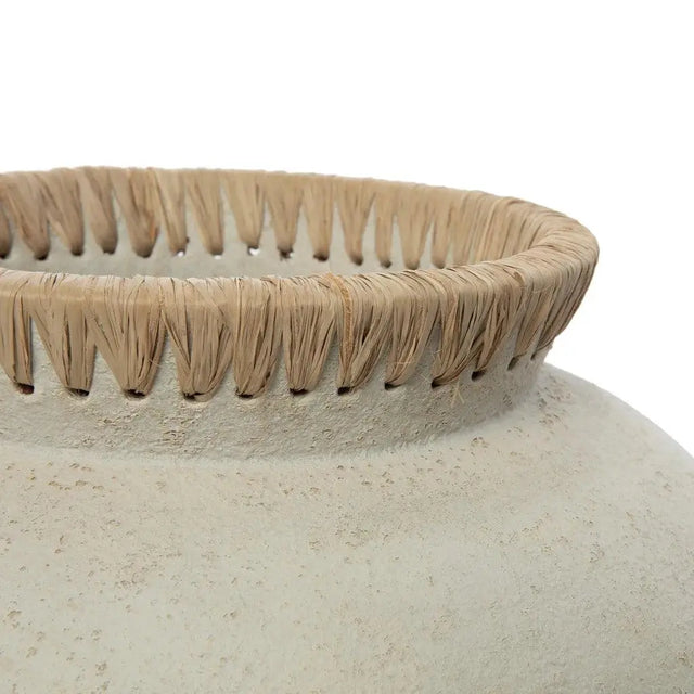 The 'Styly' Vase, made of terracotta with rattan accents, offers a coastal-inspired look, perfect for a living room or bathroom