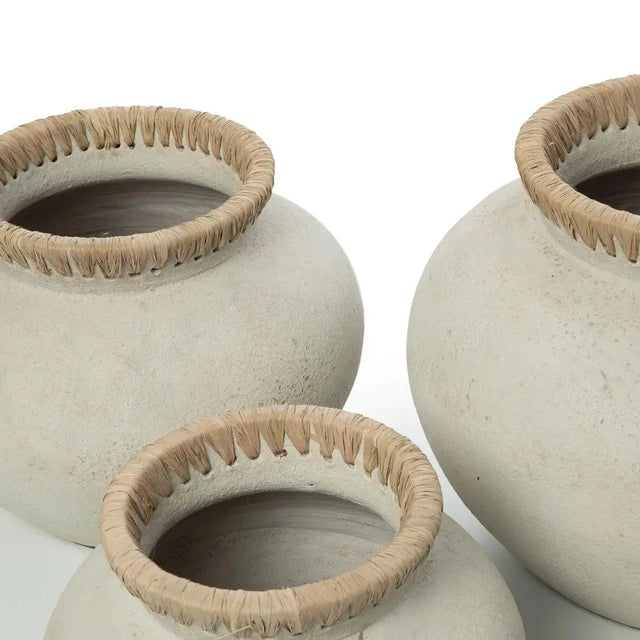 Elevate your space with the 'Styly' Vase, featuring terracotta craftsmanship and rattan detailing, perfect for dried flowers