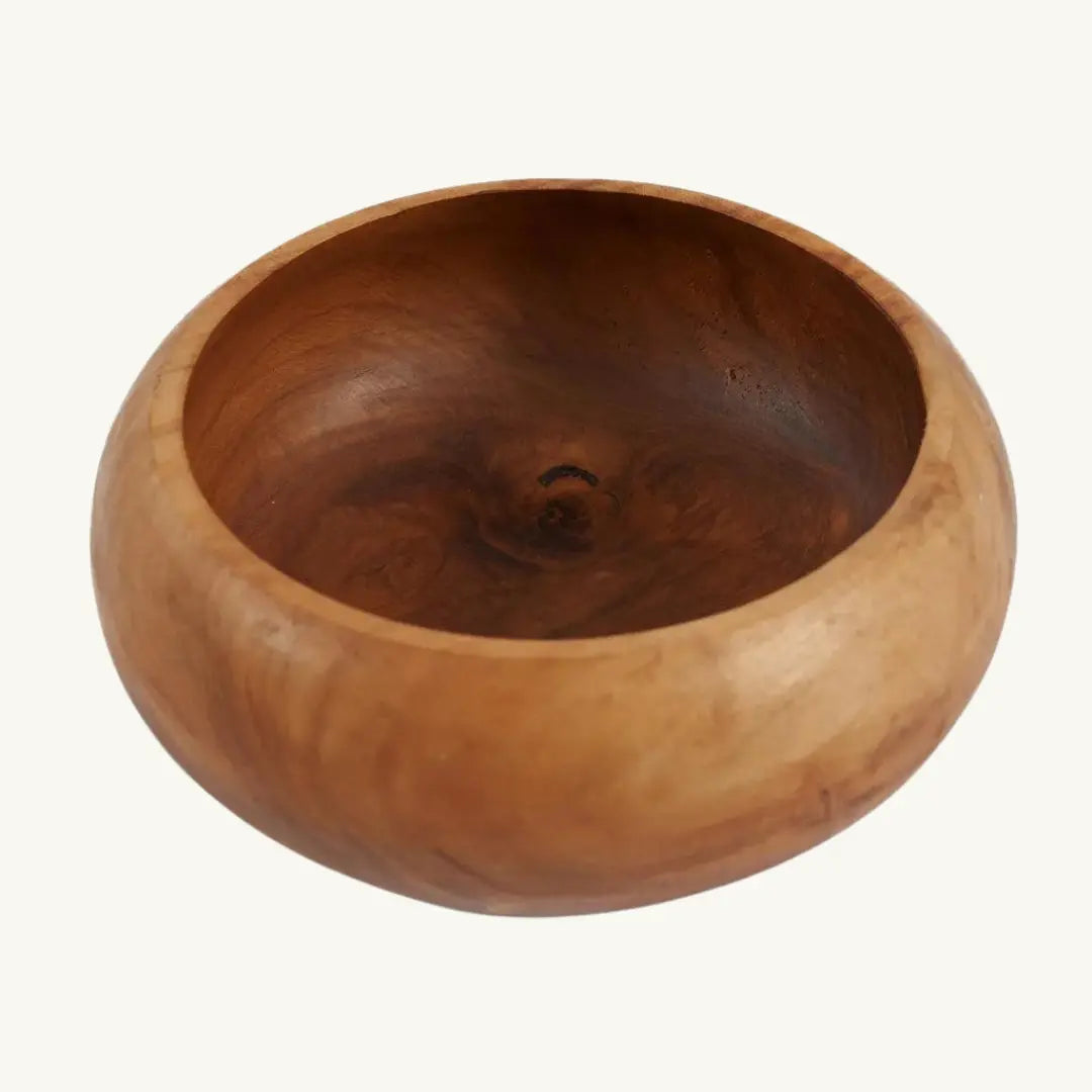Elegant fruit bowl made from sustainably sourced teak root, showcasing unique organic shapes and rich hues for a nature-inspired look.