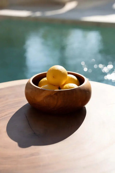 Versatile fruit bowl made from sustainably sourced teak root, offering an elegant, eco-conscious touch to your dining space.