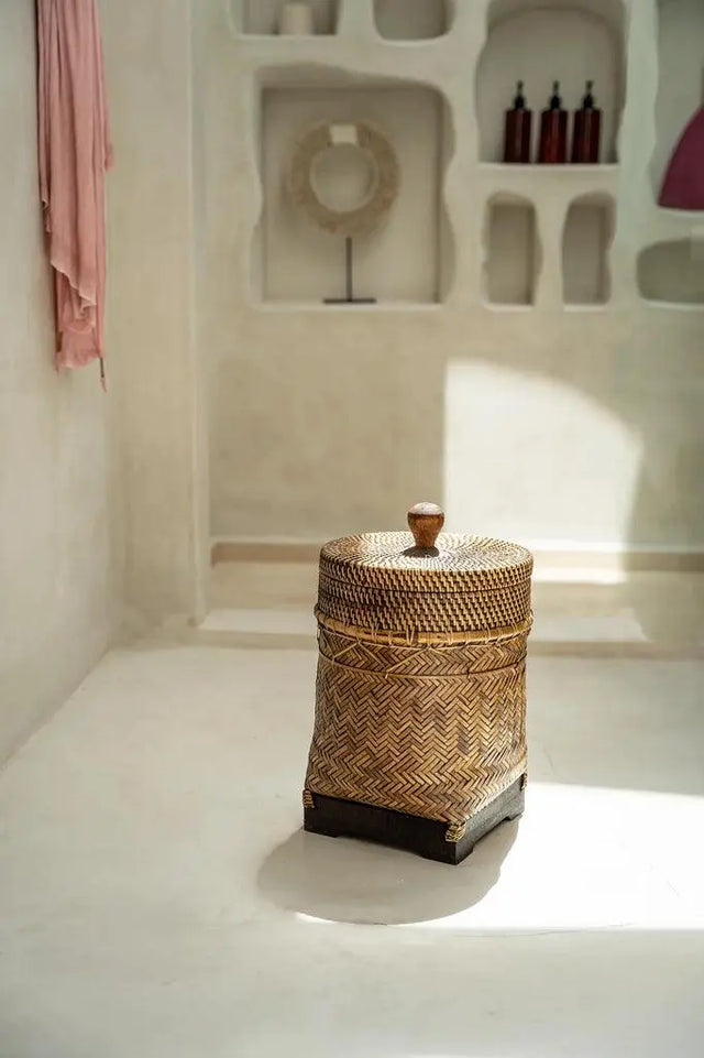 Add rustic elegance to your home with this handwoven rattan basket. Its natural brown tones and versatile design make it perfect for organizing small items in any room.