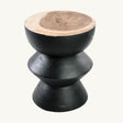 Elevate your decor with the Kulun Stool. Made from natural Suar wood, this handcrafted piece features a sleek black finish, perfect for modern interiors.