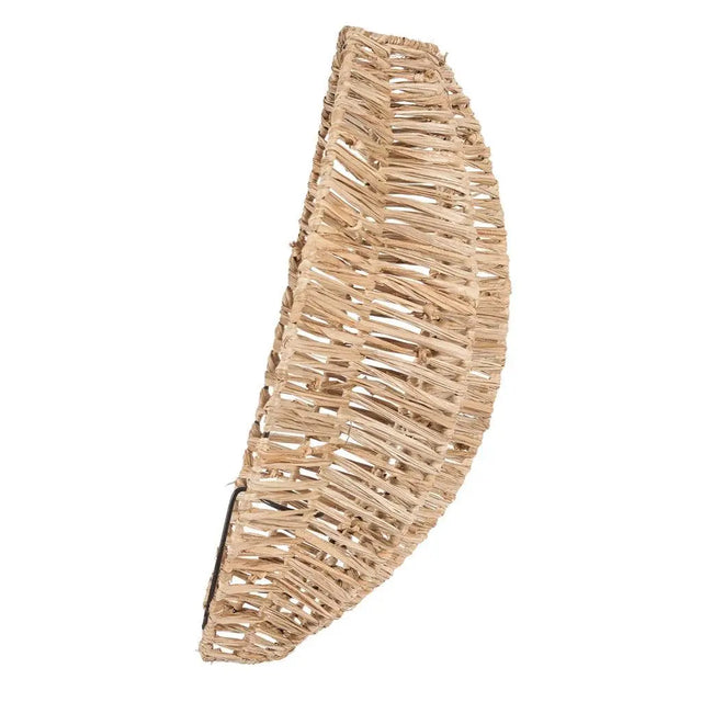 Elegant raffia wall lamp that creates ambient light, ideal for adding a boho flair and unique design to your home interior.