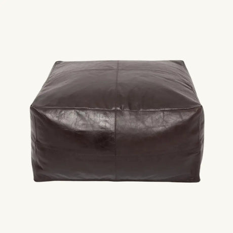 Stylish chocolate nappa leather pouffe, a perfect addition to your living room or bedroom. A luxurious and comfortable seating option.