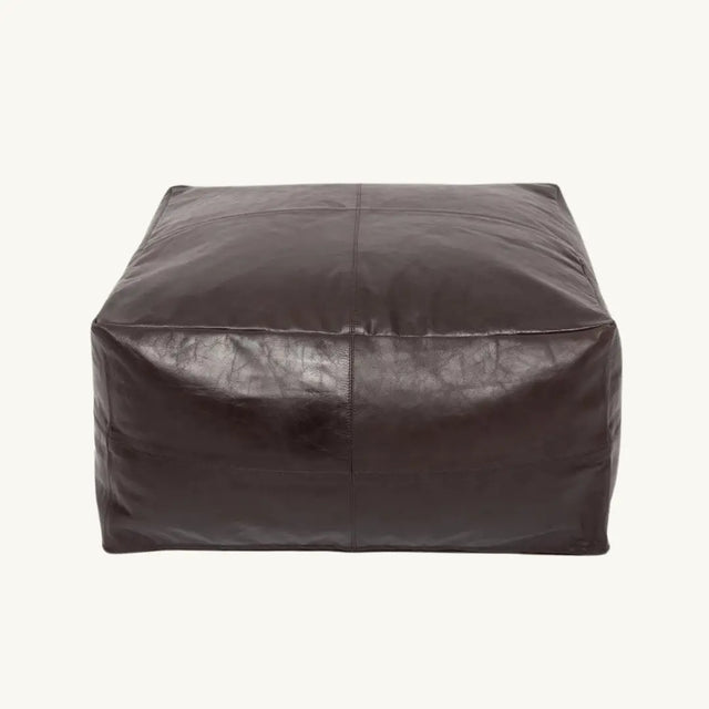 Stylish chocolate nappa leather pouffe, a perfect addition to your living room or bedroom. A luxurious and comfortable seating option.