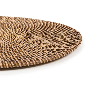 Stylish handwoven rattan placemat, oval-shaped and natural brown, ideal for bringing a relaxed, island-inspired look to your table décor.