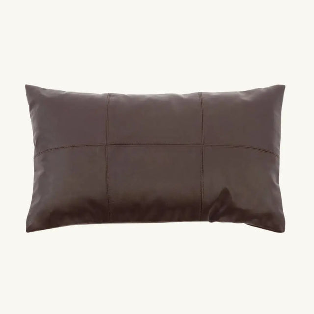 Add a refined touch to your living space with this luxurious chocolate brown leather cushion. Crafted with soft calfskin leather and a suede-textured backing, perfect for modern or rustic interiors.