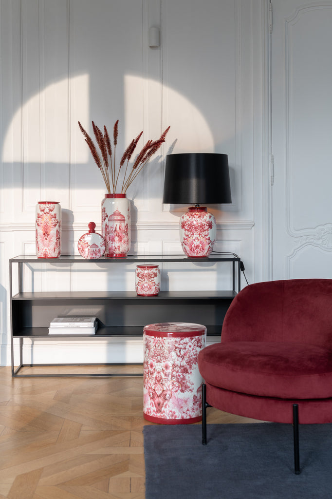 The Vase Moriko Porcelain Red/White displayed on a modern console table, enhancing the space with its sophisticated red and white color scheme and timeless porcelain craftsmanship.