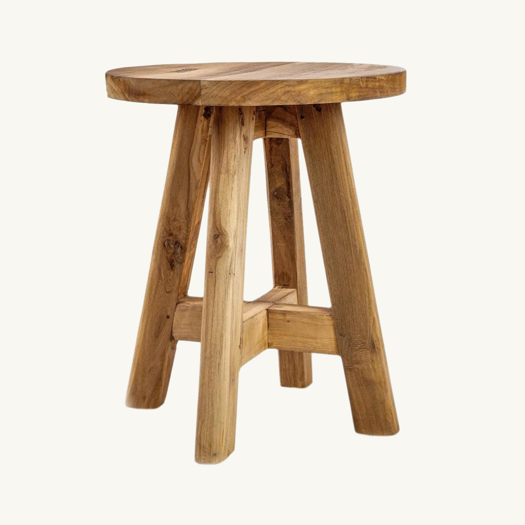 Atziri Teak Wood Natural Stool with a round top and sturdy legs, handcrafted from sustainable teak wood by Indonesian artisans.