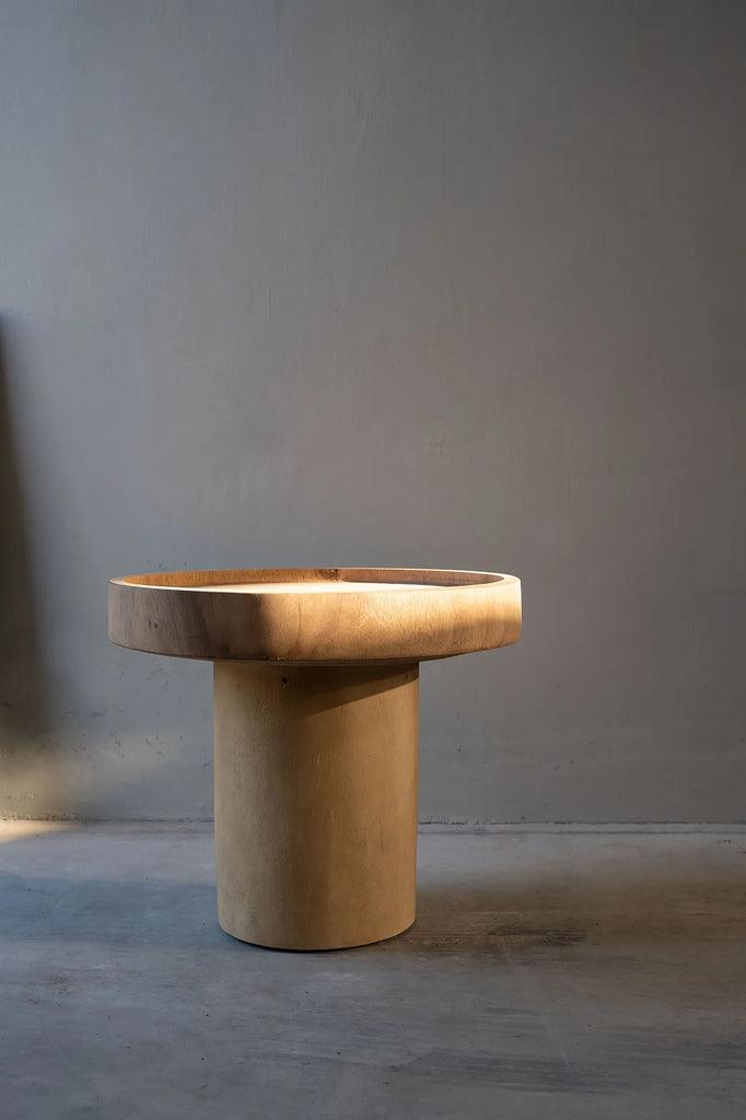 Close-up of the Chimborazo Side Table's untreated suar wood surface, highlighting its organic texture and natural color